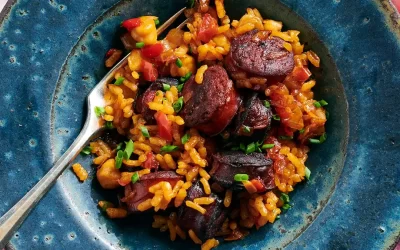 Baked Spanish Rice with Chorizo, Chickpeas, and Raisins